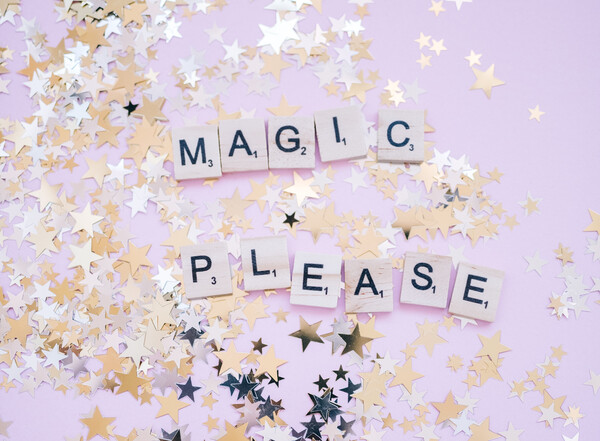 Glitter stars a scattered around a sign that says 'Magic Please'.